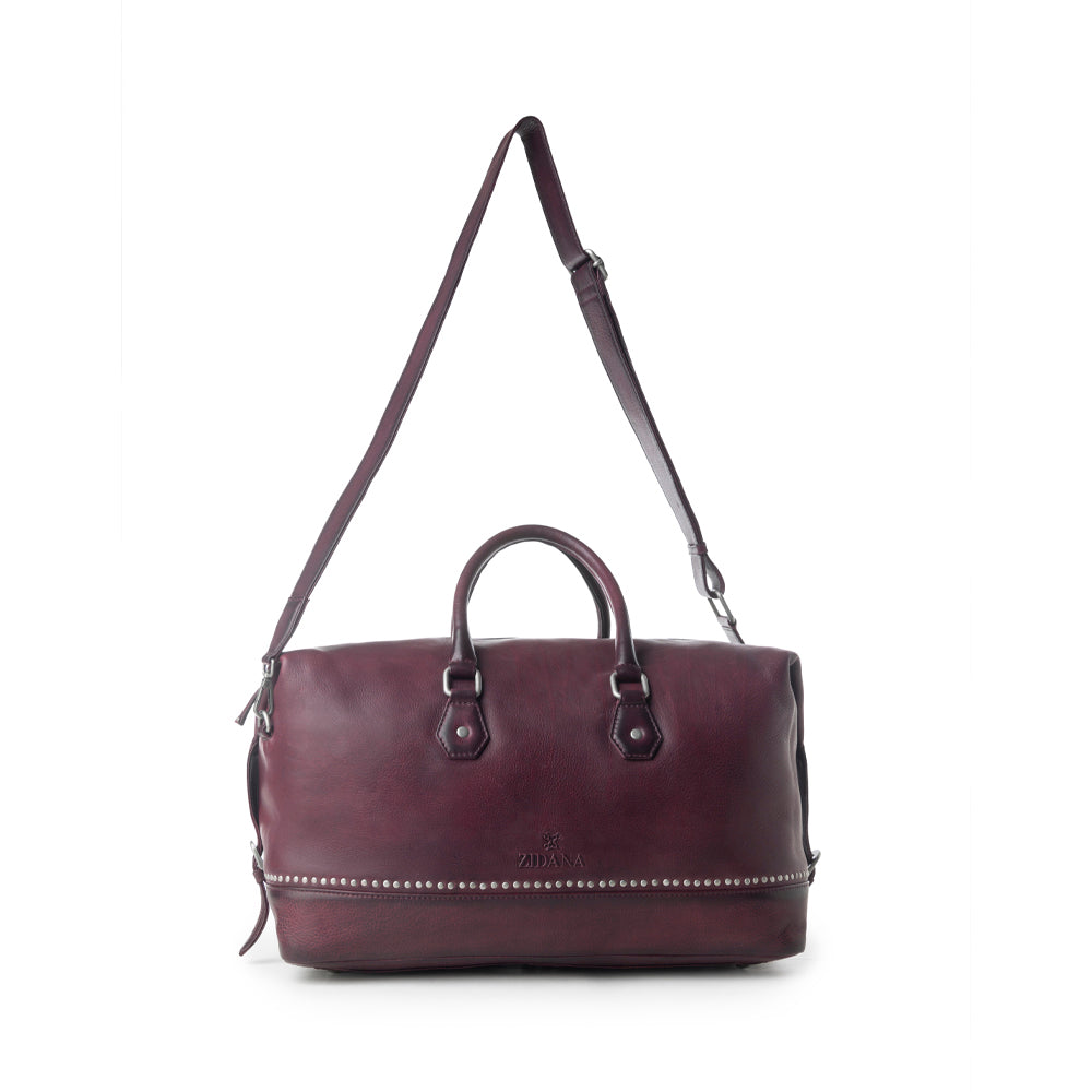 Myra Zidana Sundown Plains Veg Tanned Leather Traveller Bag in Dusty Berry