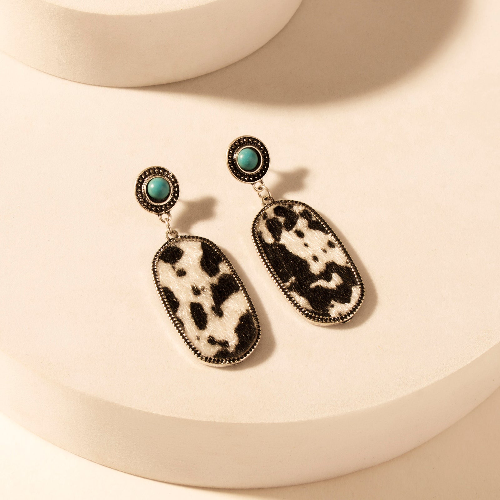 Wild Hide Dangle Earrings for Women with turquoise and cowhide print detail for premium western wear